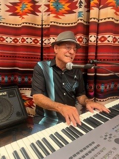 photo of Paul Solano playing keyboard